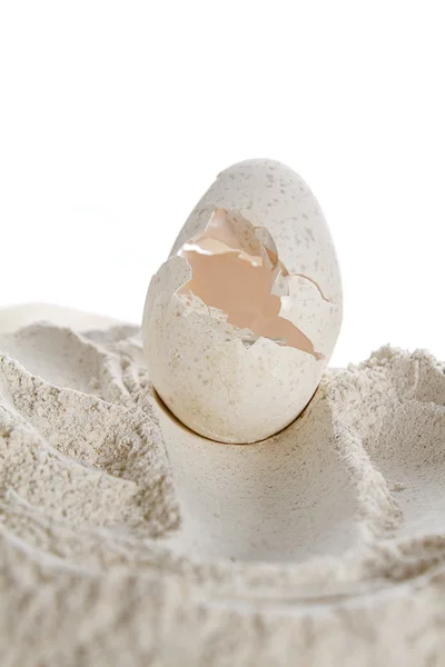 stock image Craked egg on flour